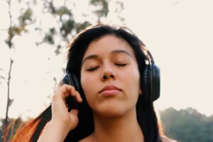 Person listening to music while wearing headphones